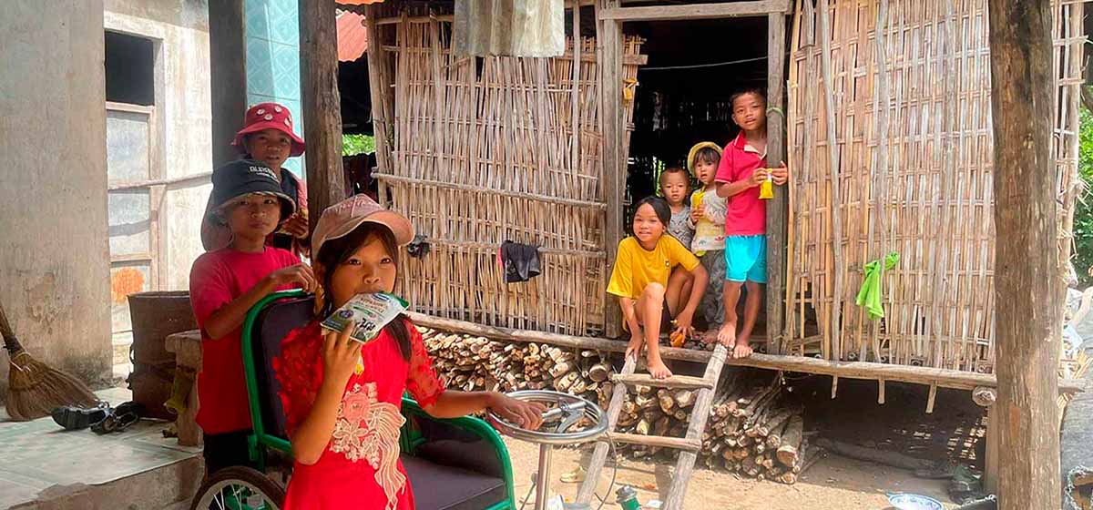 Vietnamese children enjoying probiotc yoghurt