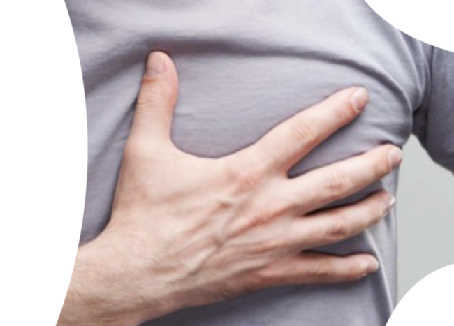 Image of man touching his chest, on the left side where his heart is.