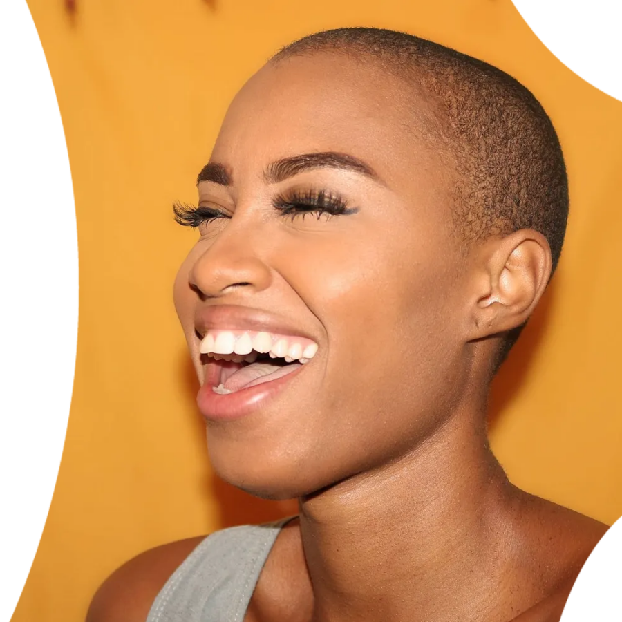 Woman of colour laughing and showing beautiful teeth.