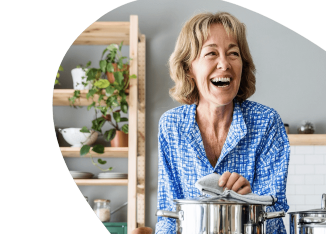 Eldery woman cooking.