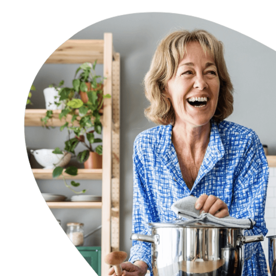 Eldery woman cooking.