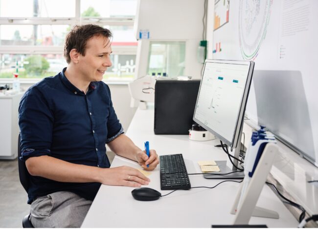 Man working on evidence-based Winclove probiotics