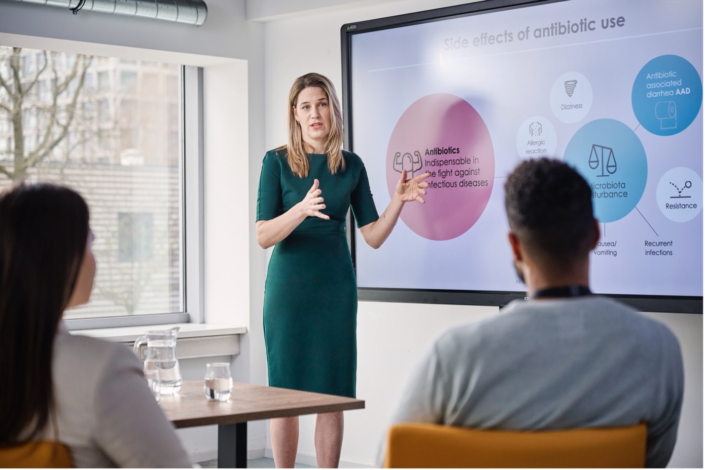 A female Winclove Probiotics employee giving a presentation to business partners.